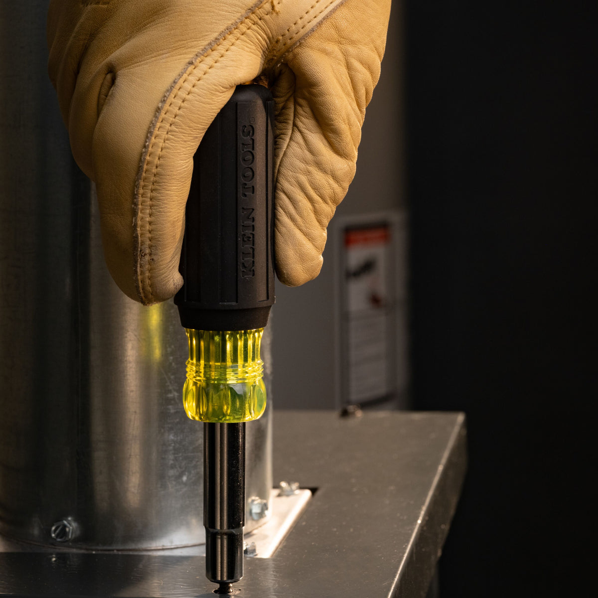 Klein Tools 32500 11-in-1 Screwdriver and Nut Driver - driving a screw