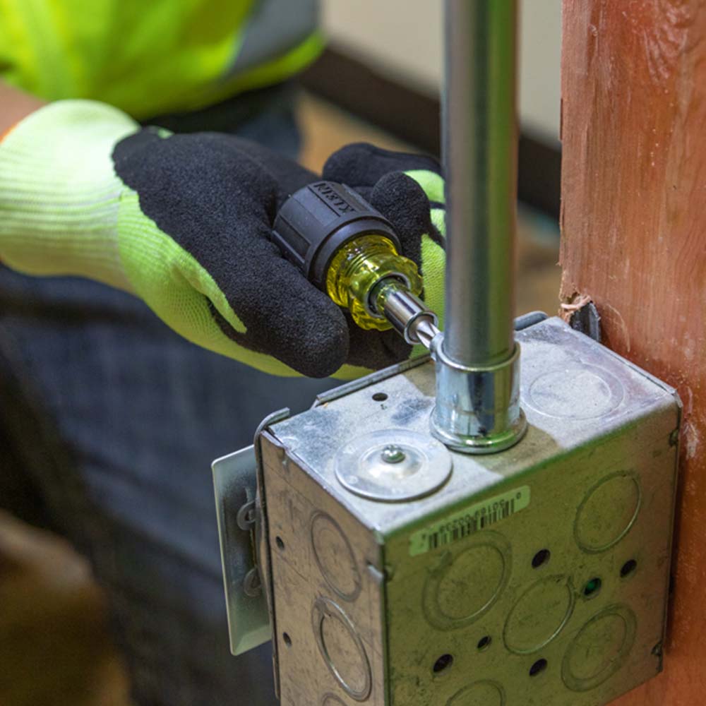 Klein Tools 32561 6-in-1 Stubby Screwdriver and Nut Driver - in use on a box